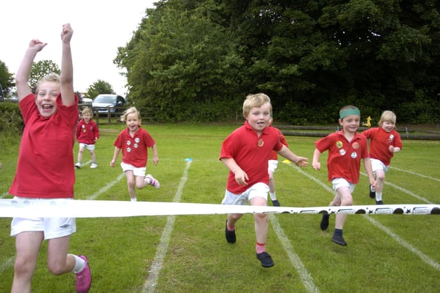 Children compete in a running race at Egton Primary School sports day.