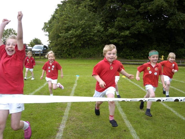 Children compete in a running race at Egton Primary School sports day.