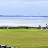 Aled Jones captures an idyllic scene during a cricket match at Sewerby with Bridlington Bay in the background.