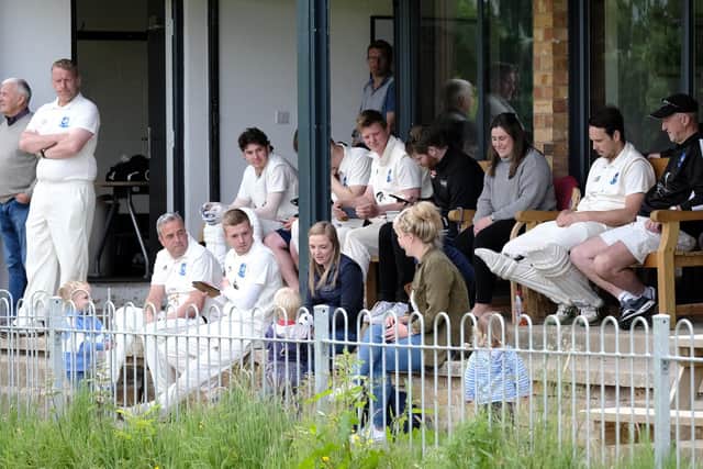 Scalby CC players and spectators enjoy their side racking up the runs against Folkton & Flixton 2nds