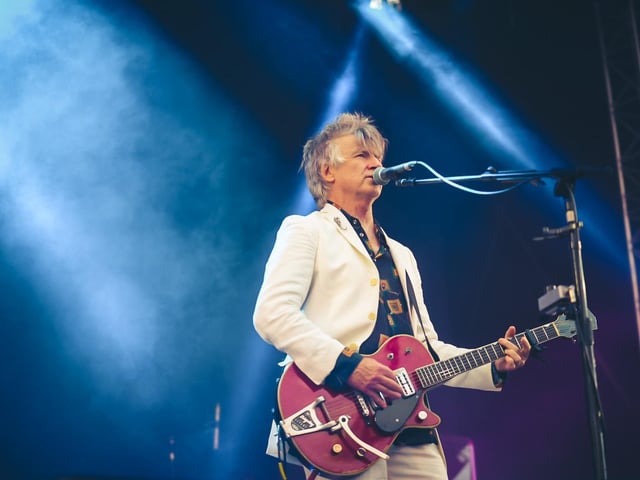 Neil Finn stood out in his white suit