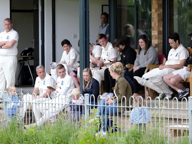 Scalby Cricket Club players and fans watch the game