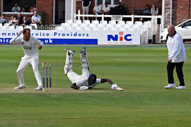 Scarborough CC batsman Romario Roach narrowly escapes being run-out