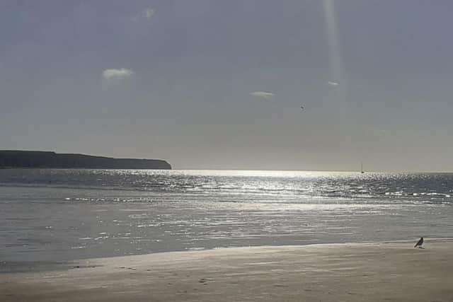 Gary Sollitt focuses on the sun’s ray glimmering on the waves for this excellent photograph.