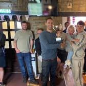 Julie and Mark Welford's son Robbie presents the Blacksmiths team with the trophy after veteran footballers raise £700 for British Heart Foundation in Mark & Julie Welford Memorial Trophy match.