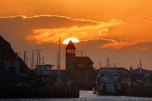 Beverley Senturk captures this dramatic tangerine sunrise.