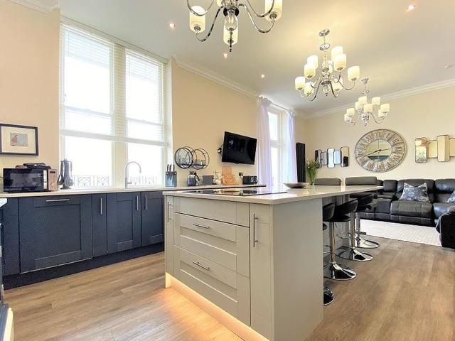 The central island with breakfast bar is a focal point of the open plan kitchen.