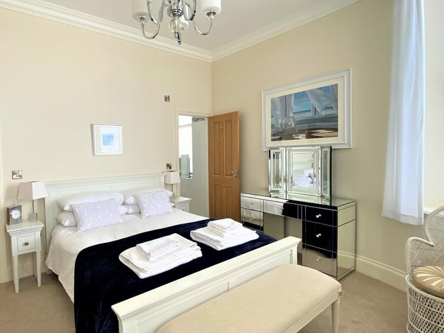 One of the light and spacious double bedrooms within the apartment.