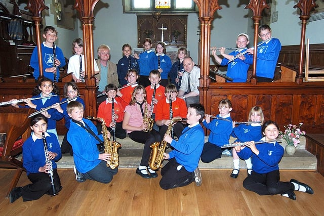 Hawsker Primary School musicians get funding for weekly jazz sessions. Pictured with the pupils are music coaches Tony Cross, left, and Bob Butterfield.