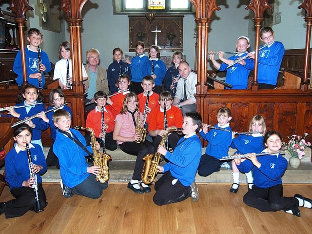 Hawsker Primary School musicians get funding for weekly jazz sessions. Pictured with the pupils are music coaches Tony Cross, left, and Bob Butterfield.