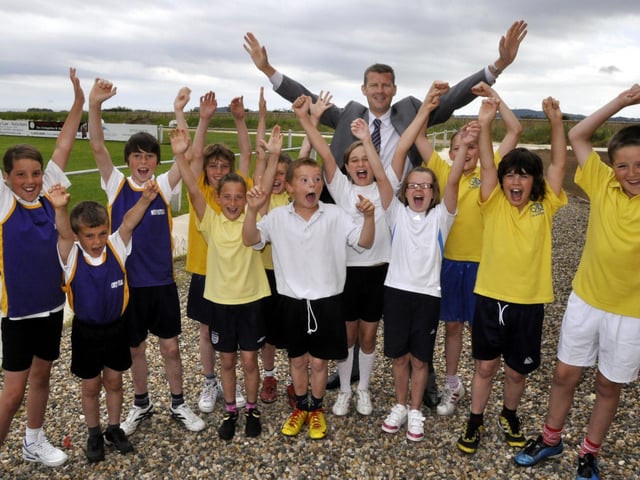 Former Olympic athlete Steve Cram, back, with youngsters from the four schools taking part in the indoor athletics competition at Scarborough Rugby Club, Northstead, Friarage, Newby and Gladstone Road.