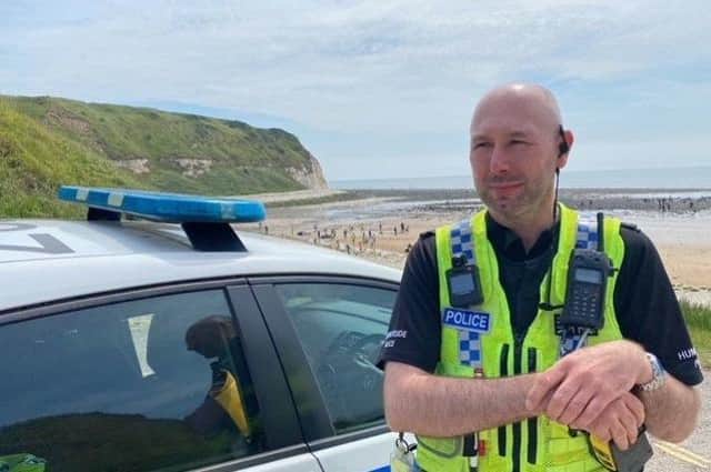 PC Chris Cook is pictured while on patrol at Flamborough.