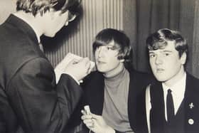 Young reporter John Hill, right, with John Lennon and an unknown newspaper reporter.
