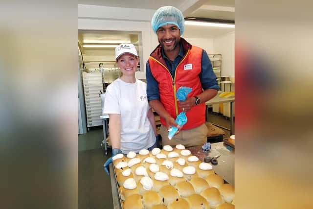 Countryfile presenter Sean Fletcher has a go at icing a lemon bun with Lois Borrett.