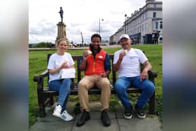 Lois Borrett and Jo Botham enjoy a lemon bun on the West Cliff with Countryfile presenter Sean Fletcher.
