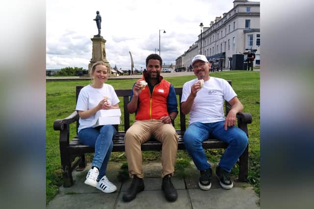 Lois Borrett and Jo Botham enjoy a lemon bun on the West Cliff with Countryfile presenter Sean Fletcher.