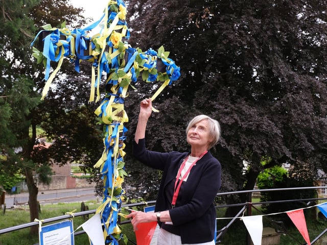 St Laurence's Church Flower Show: Sue Truefitt with the Ukraine Cross outside the church.