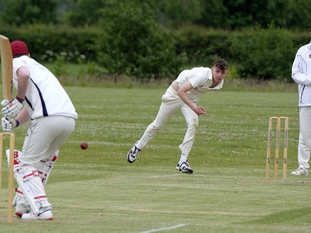 Jack Carradice-Clarkson, of Flamborough, bowls to Scarborough Rugby Club batsman Callum Norris