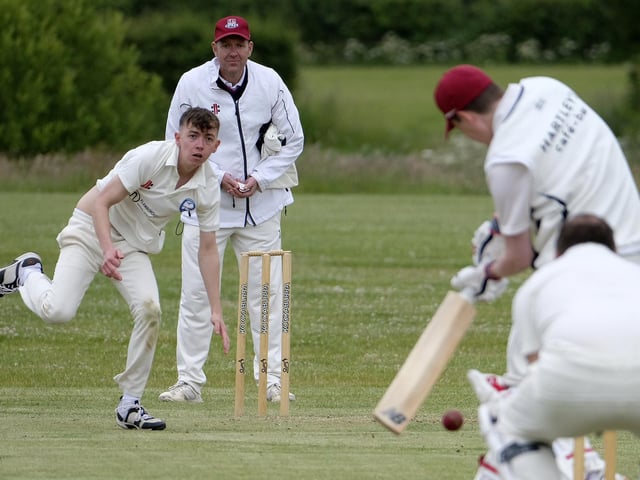Jack Carradice-Clarkson of Flamborough bowls to Scarborough Rugby Club batsman Callum Norris