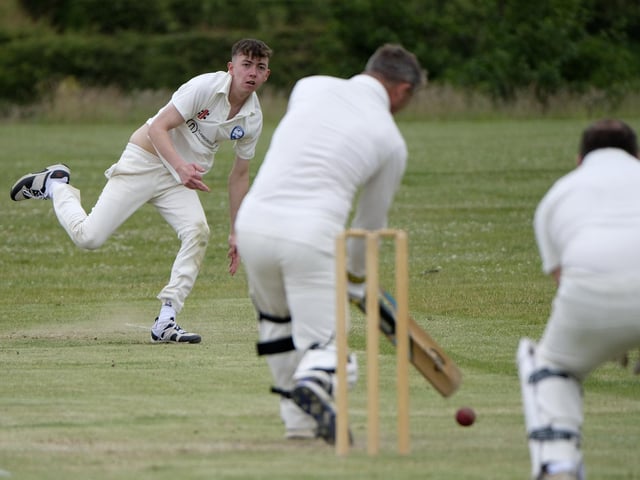 Jack Carradice-Clarkson of Flamborough bowls to Scarborough Rugby Club batter Paul Bond