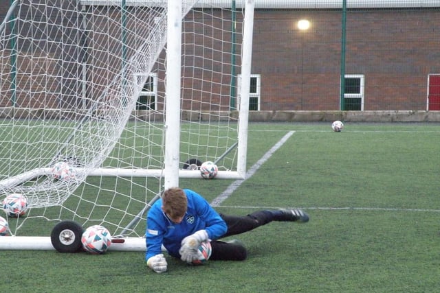 Young Whitby Town goalkeeper George Scaife makes a save