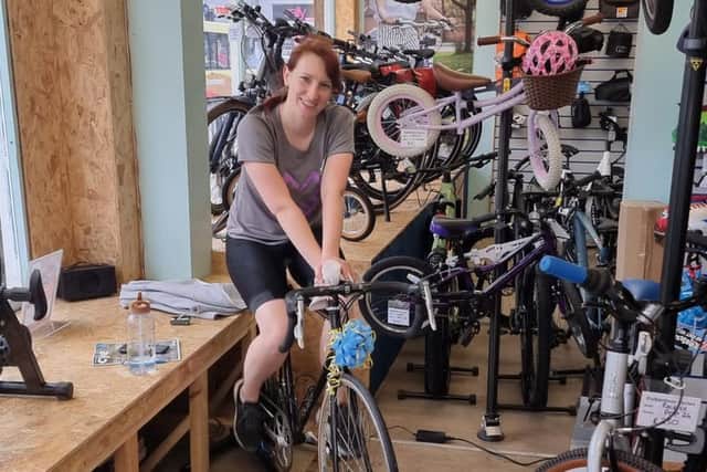 Shop manager Karen Cunningham did the lion's share of the cycling