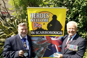 Cllr Eric Broadbent, Mayor of the Borough of Scarborough (left) and John Senior MBE TD (right) with the commemorative coins