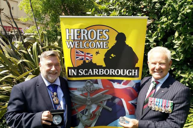 Cllr Eric Broadbent, Mayor of the Borough of Scarborough (left) and John Senior MBE TD (right) with the commemorative coins