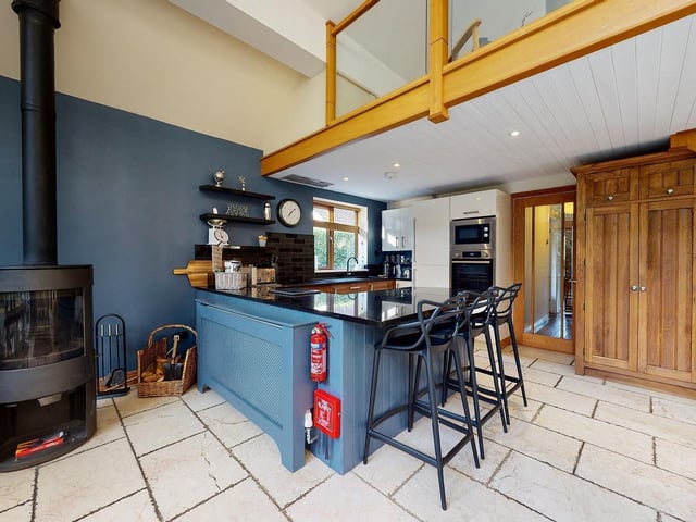 The fitted kitchen area with integrated appliances.