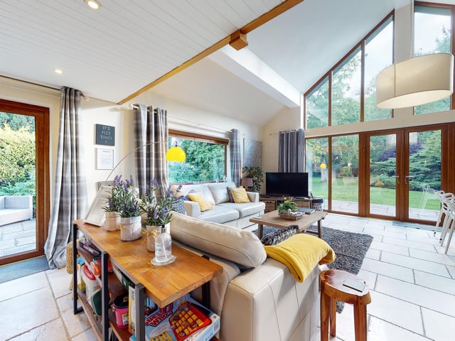 The inside of the house blends beautifully with the outside, due to the many sizeable windows.