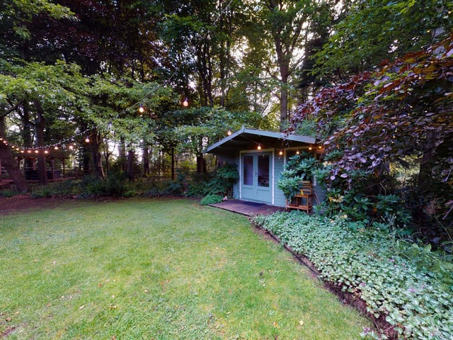 This property has grounds of almost half an acre.