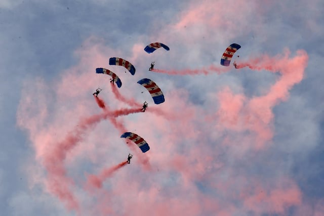The RAF Falcons Parachute team also filled the sky with red smoke