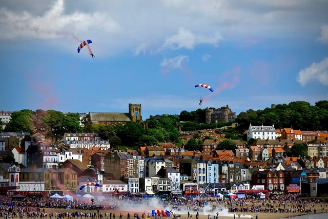 RAF Falcons over the old town of Scarborough before landing on Scarborough's South Bay Beach