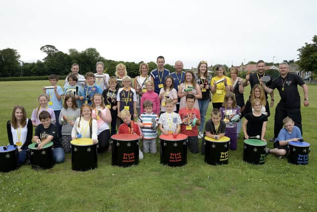 Headlands School pupils and teachers involved in the Summer School take part in a drumming workshop in 2015. (pa1530-6a)