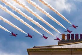 The Red Arrows seen over these Whitby chimneypots.