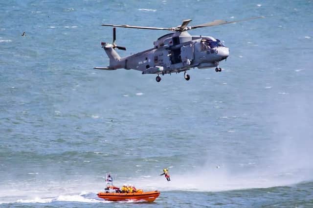 Several RNLI members were winched to the Royal Navy helicopter. Photo taken by Rod Newton