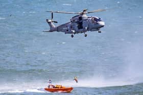 Several RNLI members were winched to the Royal Navy helicopter. Photo taken by Rod Newton