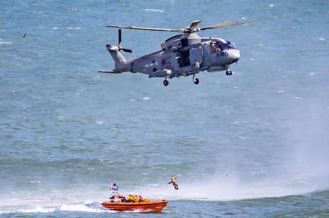 Several RNLI members were winched to the Royal Navy helicopter. Photo taken by Rod Newton