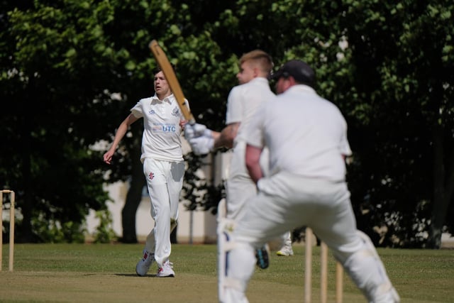 Scarborough 3rds bowler Harvey Thompson looks on as Ollie Varey hits out