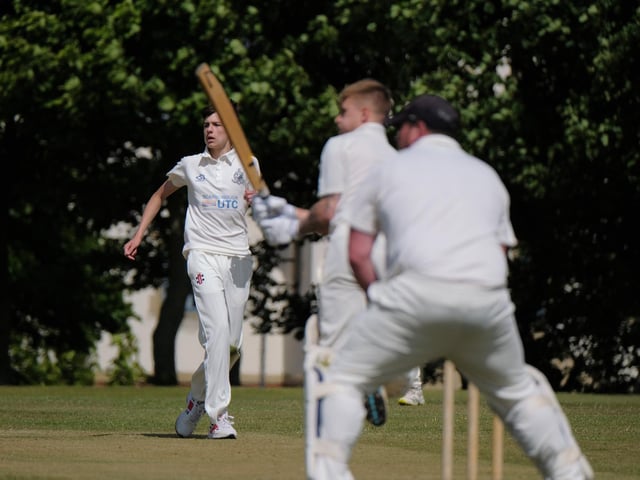 Scarborough 3rds bowler Harvey Thompson looks on as Ollie Varey hits out