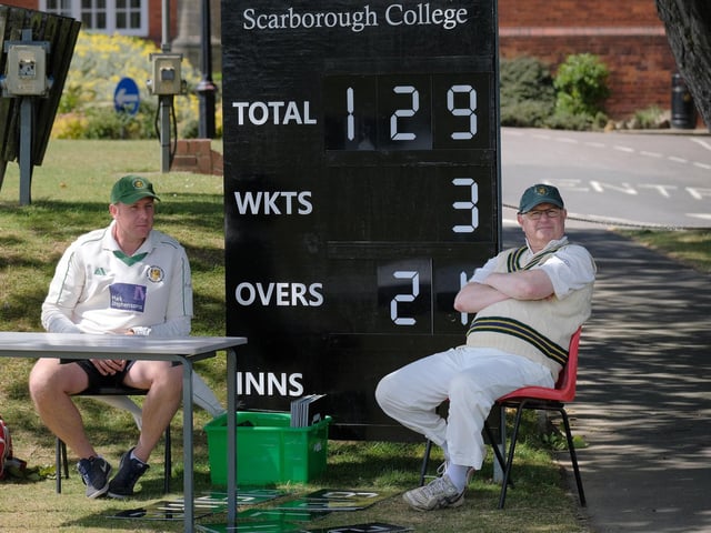 A couple of Malton & Old Malton 3rds players keep score at Scarborough CC 3rds' Scarborough College ground