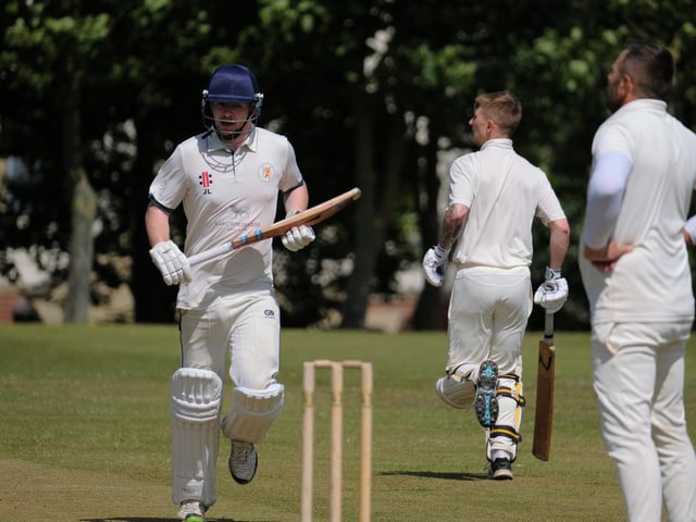 The Malton batters scamper through for a run