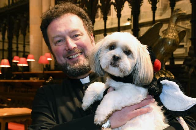 Rev Matthew at a pet blessing service in the Priory.