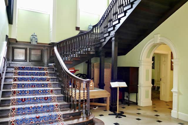 A modern day photograph by Aled Jones of the hall’s staircase.