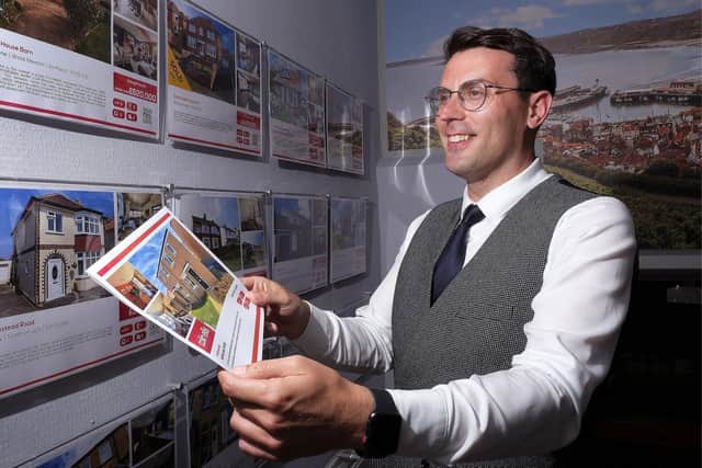 James Duncan viewing the housing information at Colin Ellis.