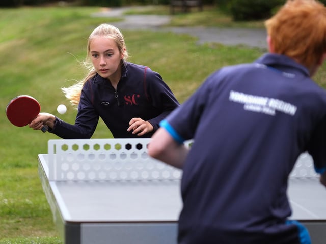 Young table tennis stars Mia Longman and Louis Fell play