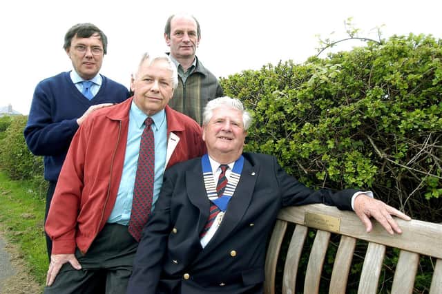 A new bench between Bempton and Buckton, paid for by the parish council and the North Wolds Lions, is installed in 2004. (PA0418-17b)