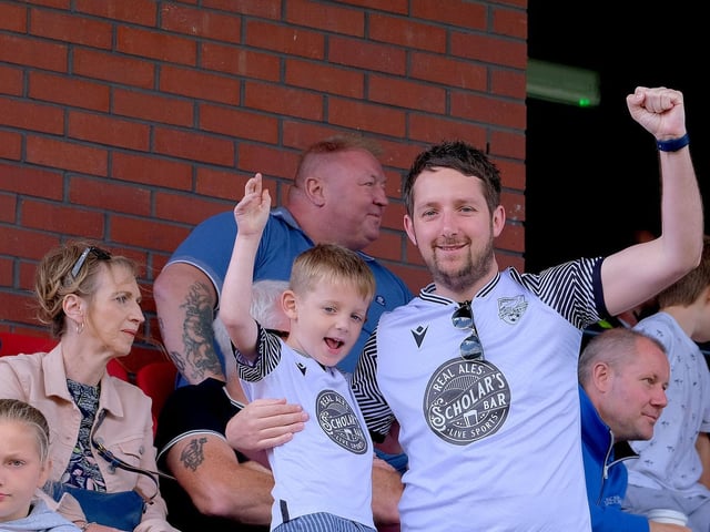 The fans, wearing the new Scarborough Athletic away shirt, cheer on the teams at the Legends match,