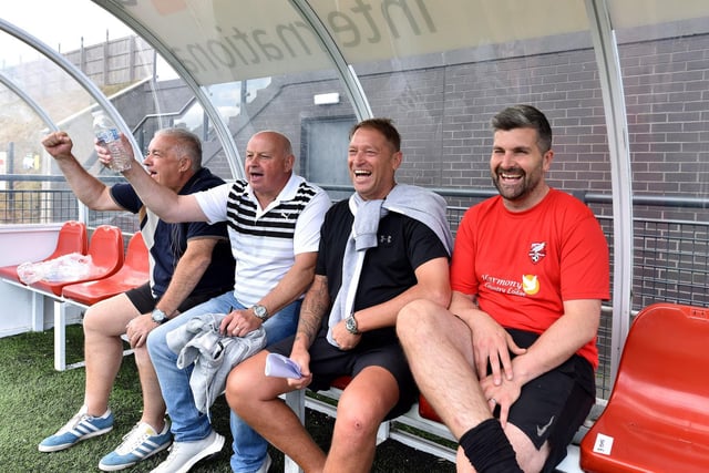 The dug-out is all smiles at the Legends match