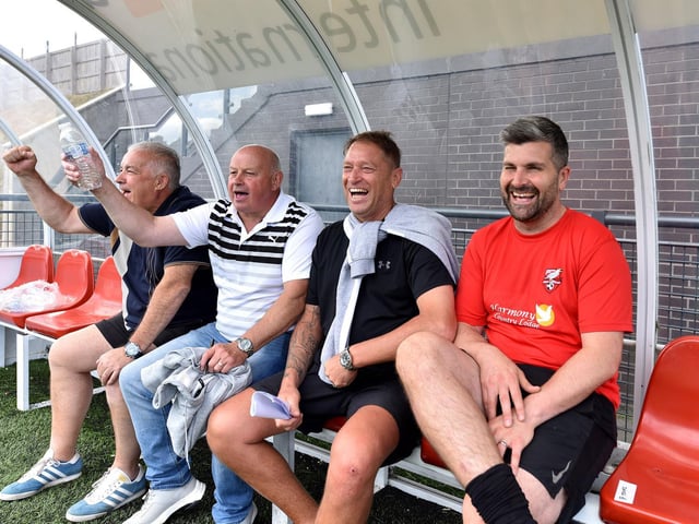 The dug-out is all smiles at the Legends match